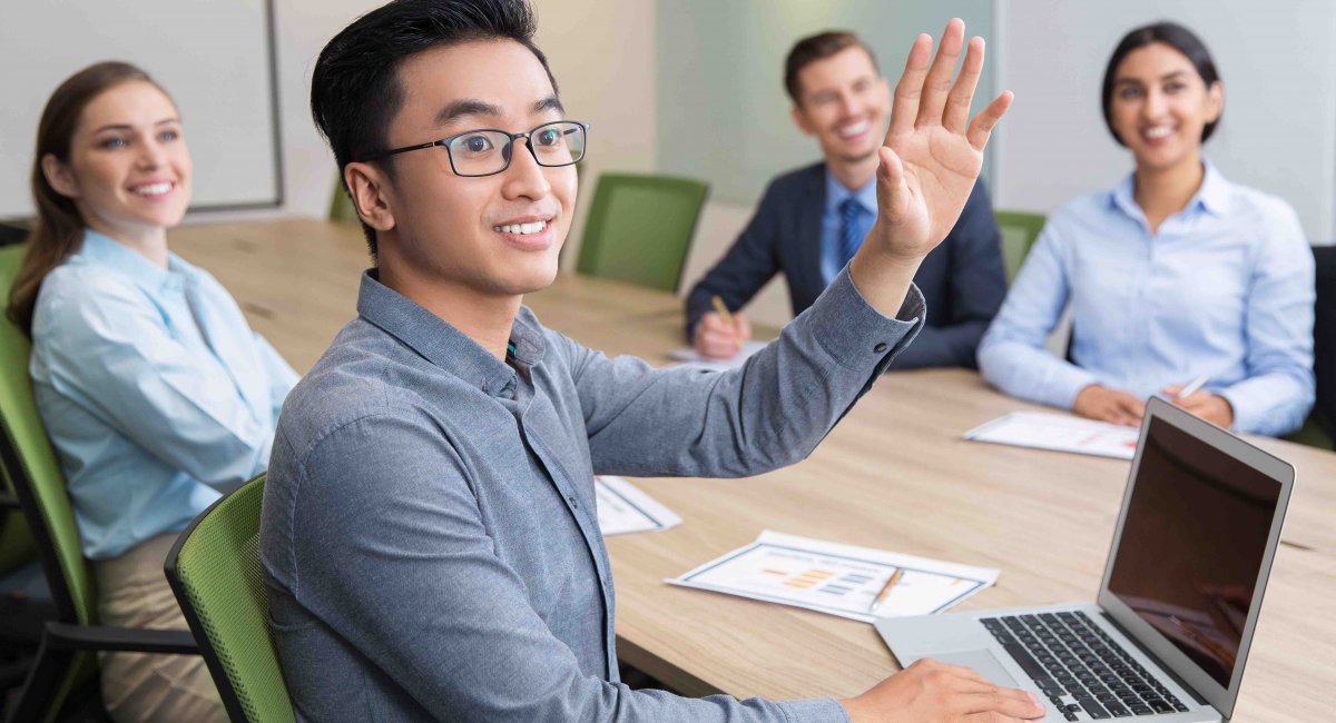 Confirm the question young man, Asian, class, raising hand, group