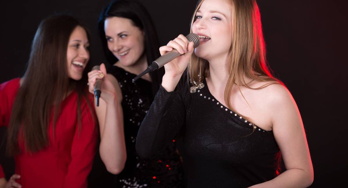 Women singing karaoke