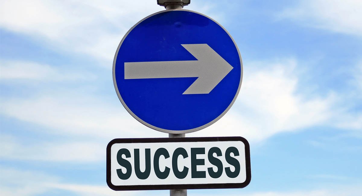 Sign with arrow pointing right and the word "success" beneath it