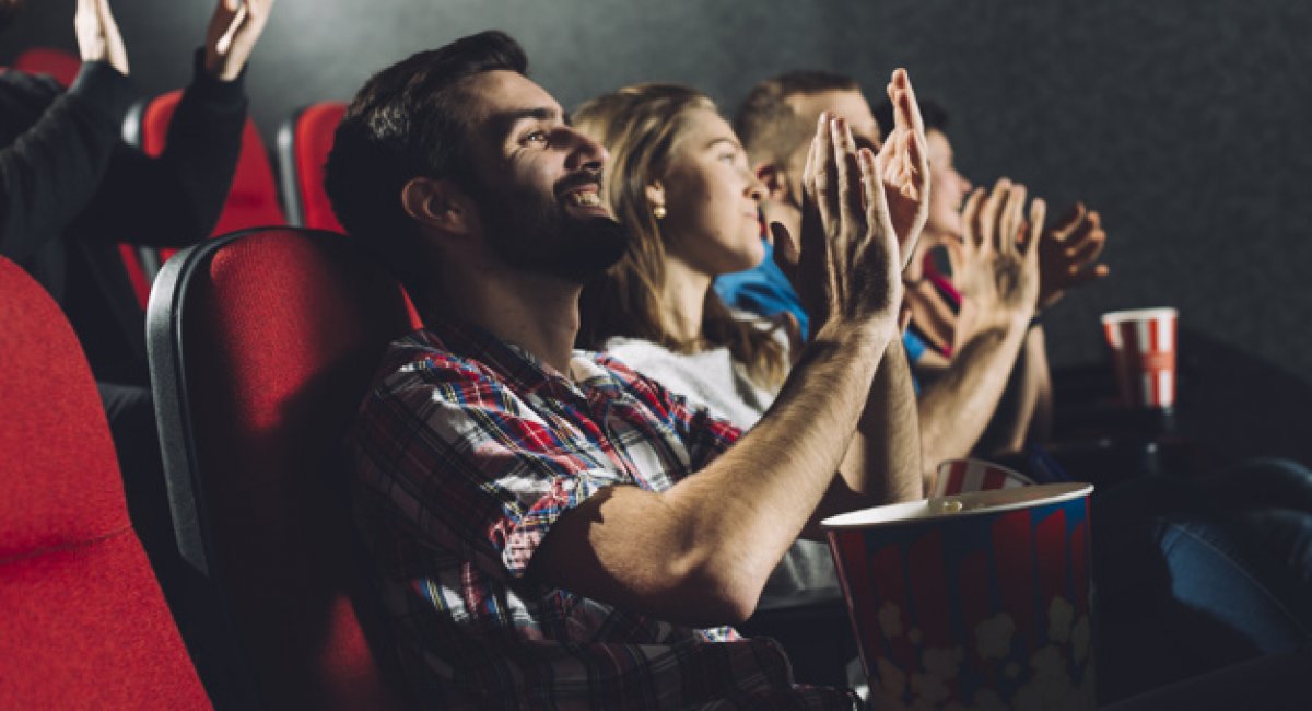 people applauding to film