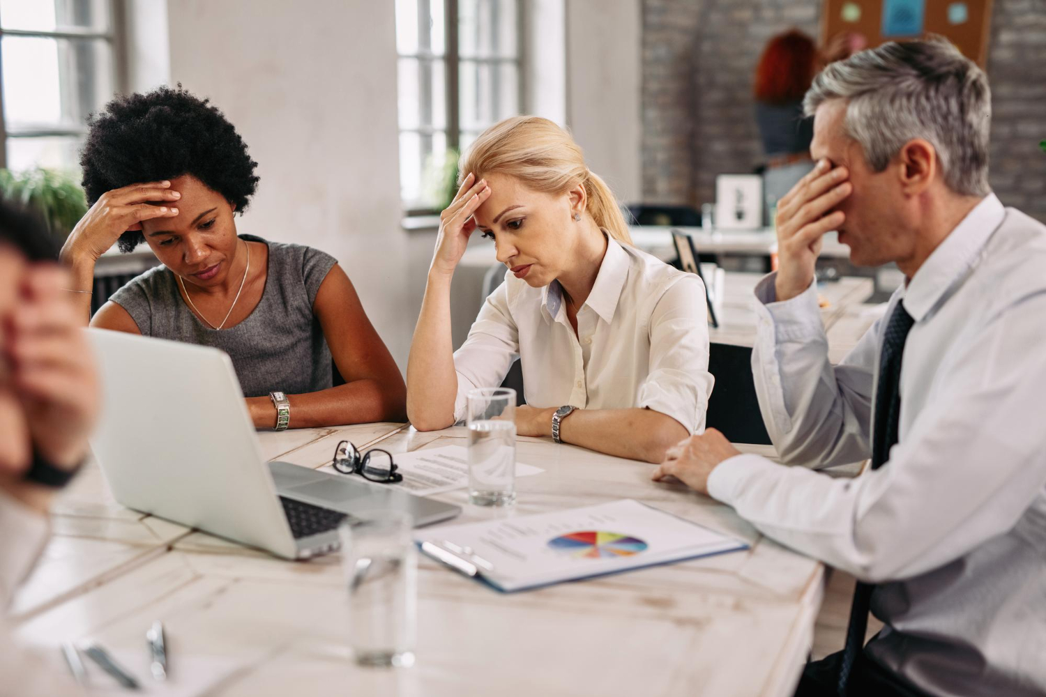 Colleagues looking worried during a meeting
