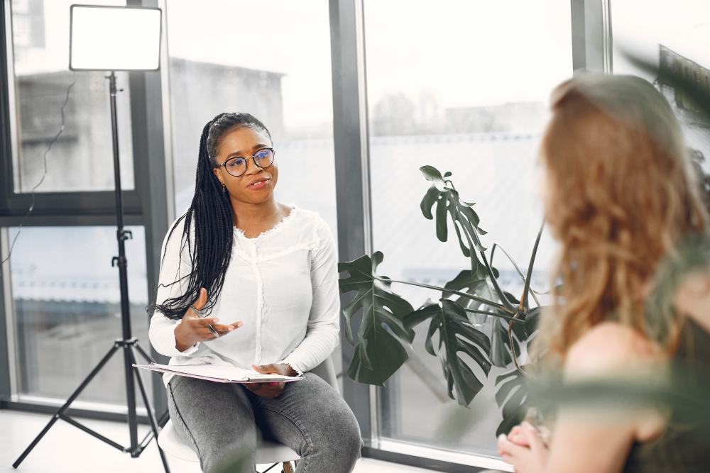 A woman interviewing another woman