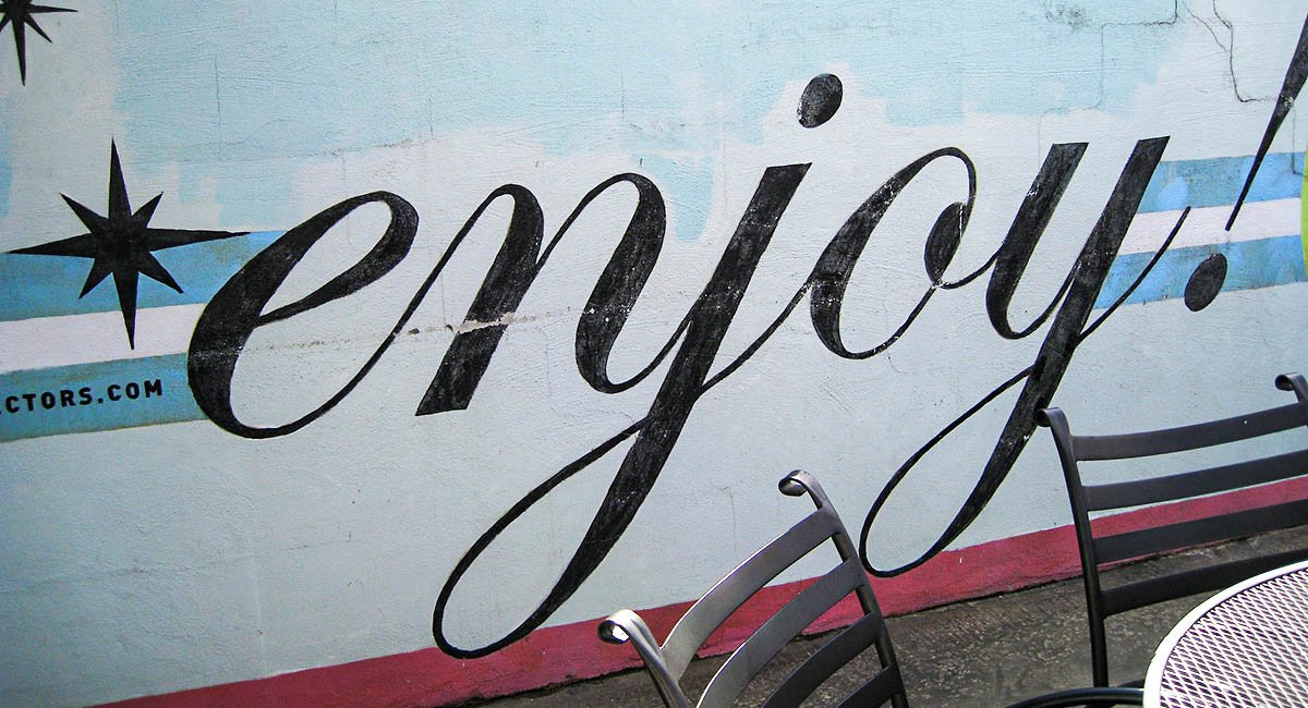 word enjoy on side of food truck