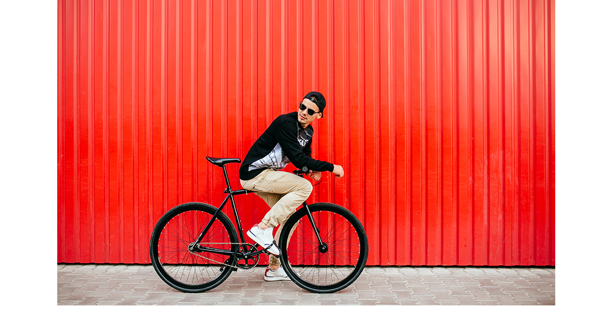 Man on a bike looking backwards