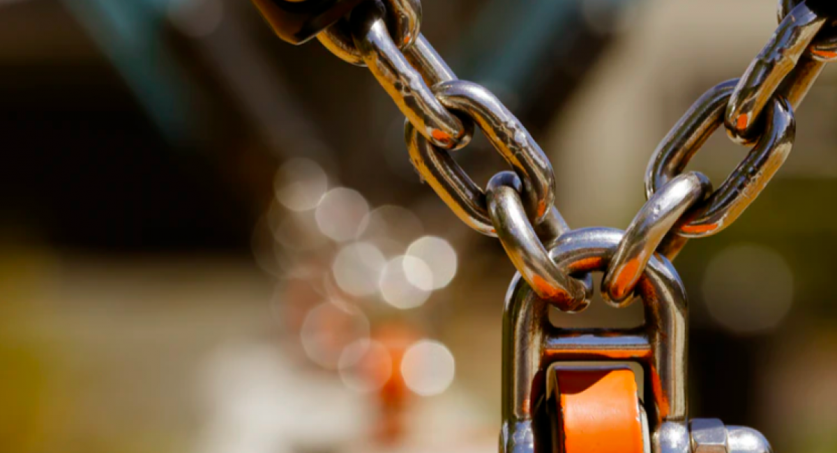 Chains linked with padlock